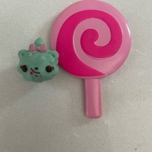 A lollipop and a baby cat